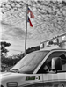 Ambulance in front of flags
