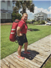 EMS staff member carrying equipment