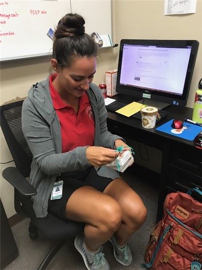 EMS staff opening a gift