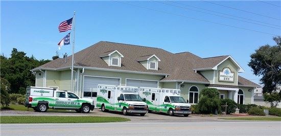 EMS vehicles in front of building
